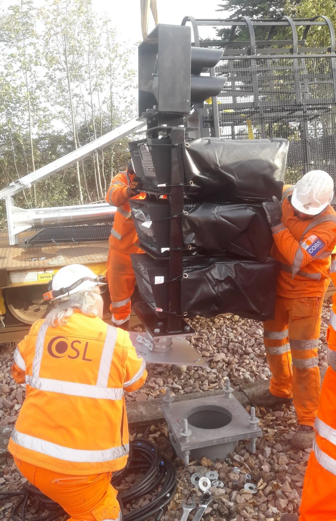 OSL engineers installing a signal