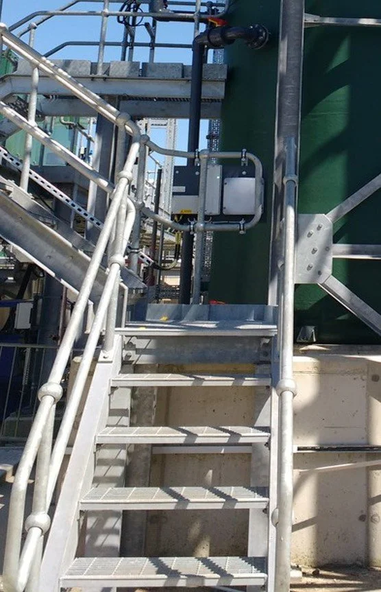 Access stairs to a treatment tank